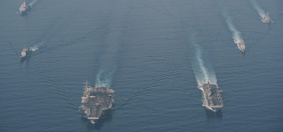 USS Theodore Roosevelt and USS Makin Island meet in the South China Sea